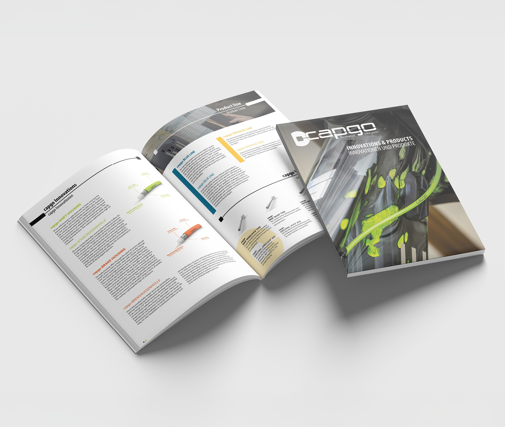 Es wird eine Broschüre mit dem Titel Cargo: Innovations & Products gezeigt, wobei ein Exemplar geschlossen ist und den Umschlag zeigt, während ein anderes aufgeklappt ist, um bunte Grafiken, Diagramme und Produktinformationen auf den Innenseiten zu präsentieren.